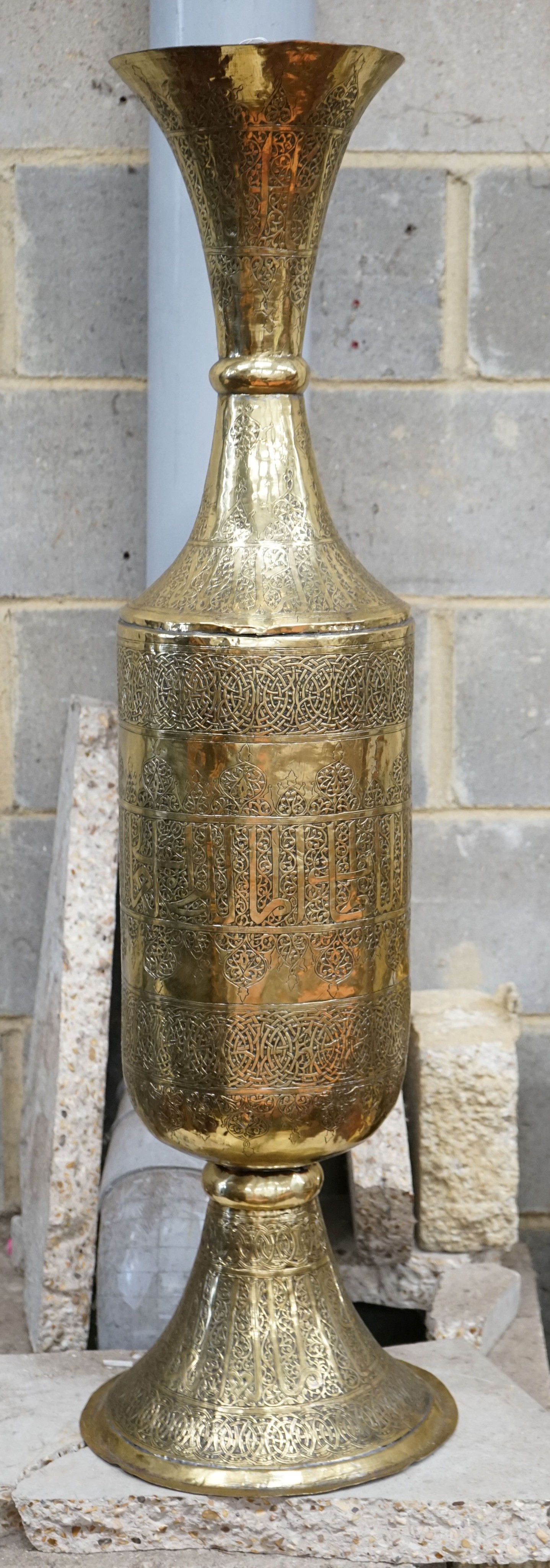A large Syrian embossed brass floor vase, height 113cm